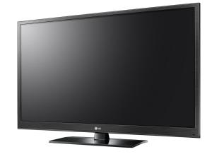 a flat screen computer monitor sitting on a stand at A&K Guest House in Sandweiler