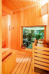 a wooden sauna with a fish tank in it at Luxurious Villa Private Pool Private Beach Views in Bodrum City