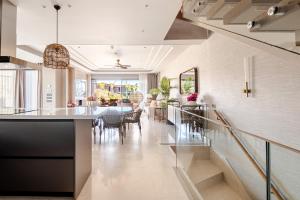 a kitchen and dining room with a table and chairs at Luxurious Villa Private Pool Private Beach Views in Bodrum City +70 photos