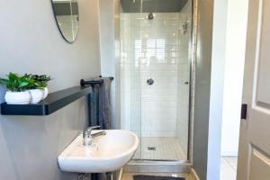a bathroom with a sink and a shower at Hilton Heath in Hilton