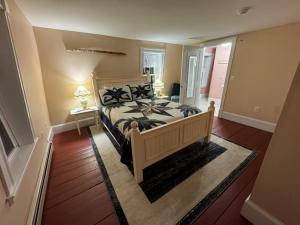 a bedroom with a large bed in a room at Ballard House Inn in Meredith