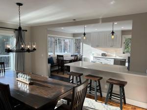 a kitchen and dining room with a table and chairs at Mill Lane in Stowe