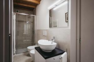 a bathroom with a sink and a toilet and a shower at L'oasi di Renata in Lammari +22 photos