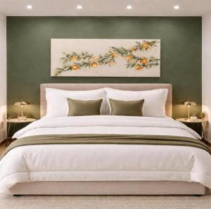 a bedroom with a large white bed with two lamps at Villa Verde Royal in Kaštela +38 photos