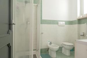 a bathroom with a shower and a toilet and a sink at Lore Sole in Caluso +25 photos