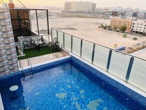 a swimming pool on the balcony of a building at فندق ليان بارك Lian Park Hotel in Al Khobar