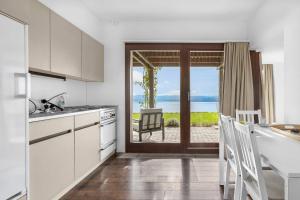 a kitchen with a view of the ocean at Studio with panoramic view in Bellerive