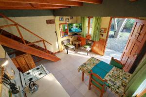 an overhead view of a living room with a table and chairs at Cabañas Tunquelen in El Bolsón