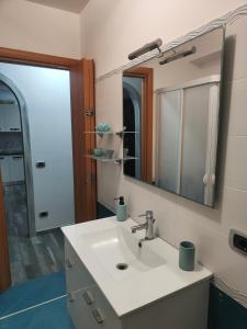 a bathroom with a sink and a mirror at Sweet Home in Oliveri +31 photos