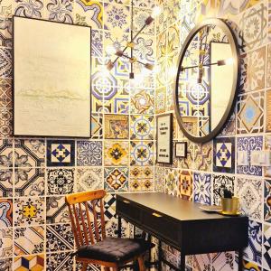 a room with a table and a mirror and tiles at Apartment Sol Dolcevita in Njivice