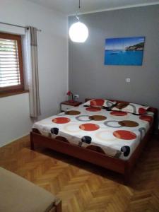 a bedroom with a large bed in a room at House " Bond " in Tisno