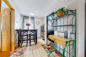 a home office with a desk and a table at Lakeside Delight, unit 423 in Laconia