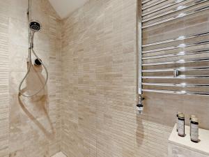 a bathroom with a shower with a shower head at 3 Bed in Witney oc-82478 in Hailey