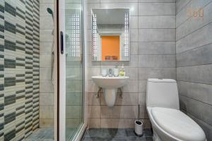 a bathroom with a toilet and a sink at Suite Victory Authentic Maltese Duplex in Birgu in Birgu +57 photos