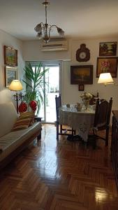 a living room with a table and a couch at Shvili en Palermo in Buenos Aires
