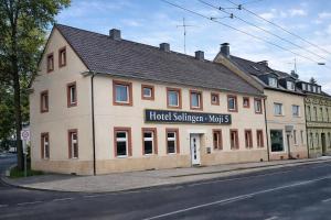 a building on the side of a street at Hotel Moji 5 Solingen in Solingen