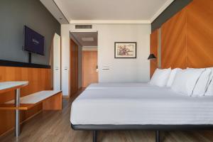 a bedroom with a large bed and a table at Dorma Juan de Austria in Valladolid +57 photos