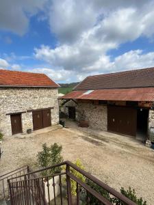 an outside view of a building with two garage at La Fermette Champenoise in Jonquery