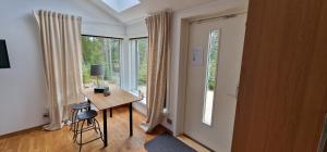 a room with a desk and a large window at HavsBo in Västerhaninge