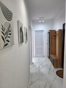 a hallway with white walls and a door at Kasibel Suites in Sandanski