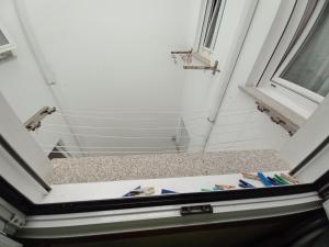a view from the inside of a room with a window at Gavor 68 in A Pobra do Caramiñal +3 photos