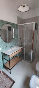 a bathroom with a sink and a shower and a toilet at B&B Casa Fattorini in Cortona +32 photos