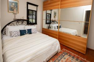 a bedroom with a large bed and a mirror at Villa Cecilia in Göcek +33 photos