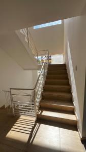 a staircase in a building with a stair case at Pousada Brisas da Serra in Serra do Cipo +28 photos