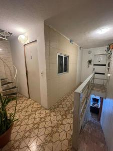 a room with a staircase and a stair case at Pousada Casamar in Maceió
