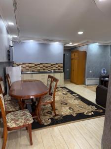 a dining room with a table and chairs in a room at Vibe Hotel Vanadzor in Vanadzor