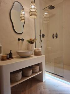 a bathroom with a sink and a shower at Old Town Living Studio in Český Krumlov +41 photos