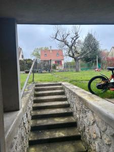 a bike is parked next to a stone wall at Chez Lina in Chartres