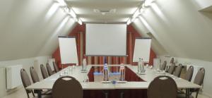 a large conference room with a long table and chairs at Auberge du Vieux Cedre, Enghien-Belgique in Enghien
