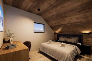 a bedroom with a bed and a wooden ceiling at ELAFON Lodge in Kolašin +4 photos