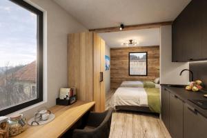 a room with a bedroom with a bed and a window at ELAFON Lodge in Kolašin