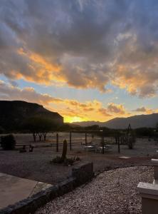 a sunset over a park with a sunset in the distance at El Chiflon Posta Pueblo in El Chiflón