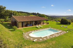 an aerial view of a house with a swimming pool at Villa Borgiano - Happy Rentals in Scansano