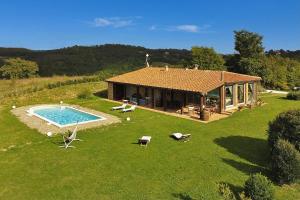 an aerial view of a house with a swimming pool at Villa Borgiano - Happy Rentals in Scansano +35 photos