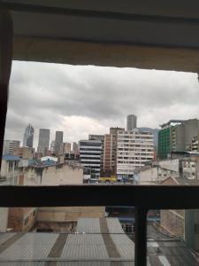 a view of a city skyline from a balcony at Hotel Cristals Centro Bogota Estacion las Nieves Calle 18 numero 10 65 in Estación El Salto