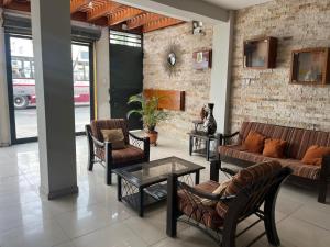 a lobby with couches and chairs and a table at Casa del Inka Perú in Lima