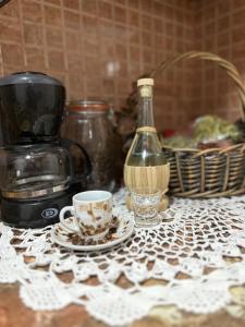 a table with a coffee maker and a cup on it at Sweet home Leskovik in Leskovik