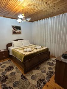 a bedroom with a bed with two towels on it at Sweet home Leskovik in Leskovik