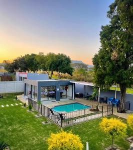 an aerial view of a house with a swimming pool at Bluenova guesthouse in Dundee
