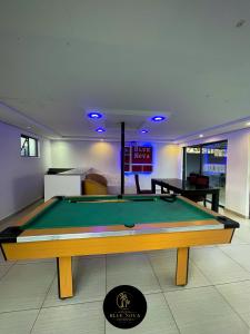 a living room with a pool table in it at Bluenova guesthouse in Dundee