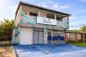a building with a sign on the side of it at Pousada Vila Formosa in Belém