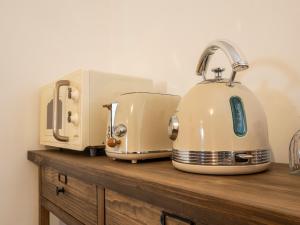 two toasters sitting on top of a wooden counter at Cjase san Pieri in Cividale del Friuli