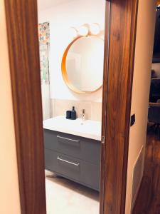 a bathroom with a sink and a mirror at Villa Perush in Vuzenica +34 photos