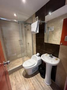 a bathroom with a toilet and a sink and a shower at Casa del Inka Perú in Lima