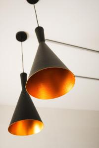 a pair of lights hanging from a ceiling at ZELUN Suite Torremolinos Center in Torremolinos +14 photos