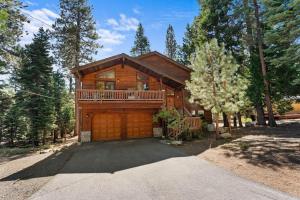 a log home with a large garage at The Wildwood Lodge in Tahoe Vista